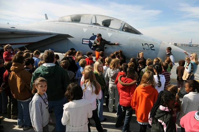 Whitesides Elementary school 5th graders learn about the F-14 Tomcat Fighter from Commander Butch Hills.
