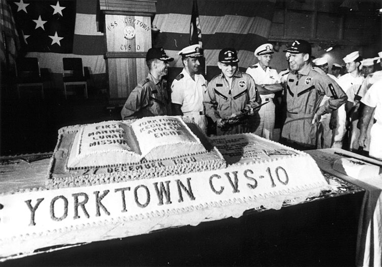 Astronauts Borman, Anders and Lovell prepare to eat cake!