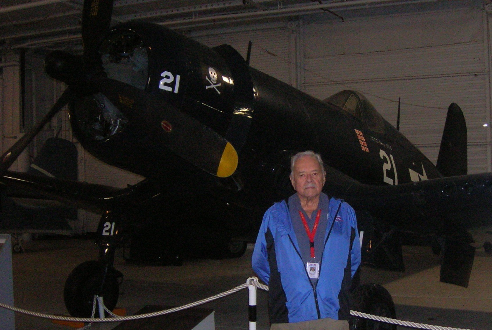 World War 2 Marine fighter pilot Bill Cart in front of Patriots Point Corsair.