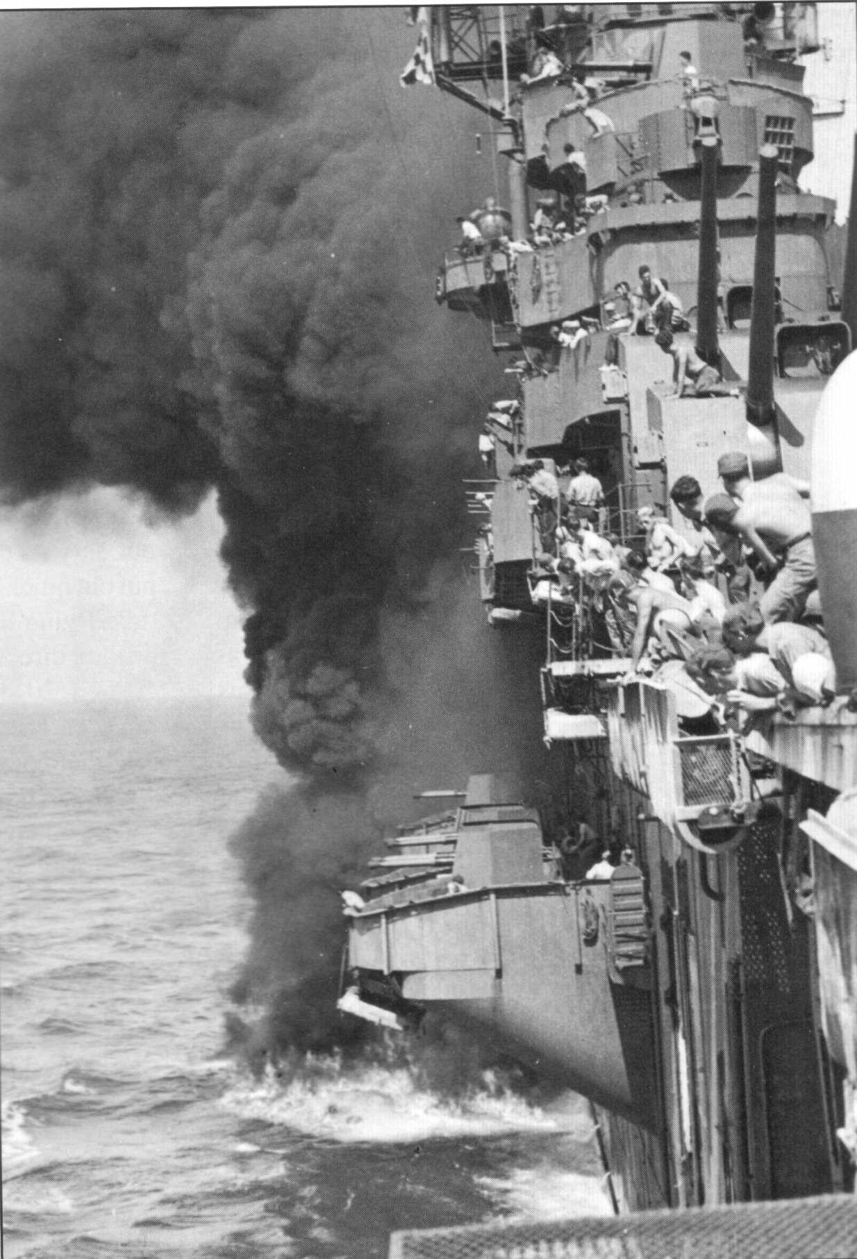 USS Yorktown (CV-10) hit by Japanese bomb at 1507, 18 March 1945 off Okinawa.