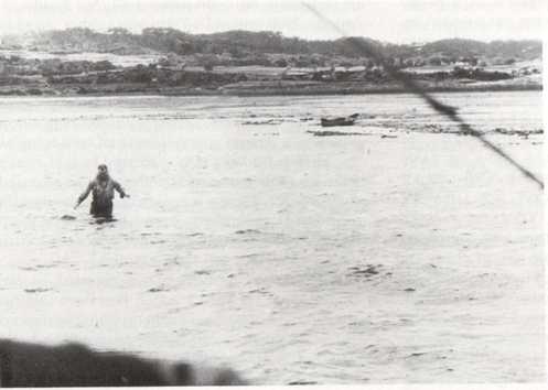 ltfox Lieutenant Fox wading towards his rescue aircraft on 29 March 1945.