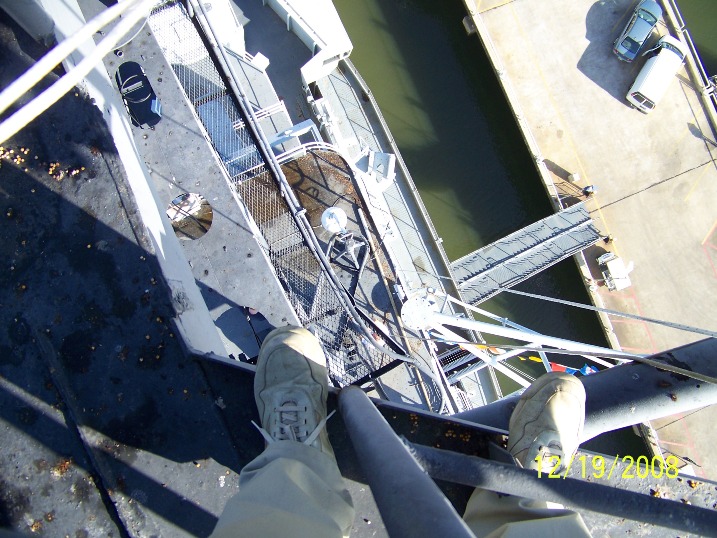 Looking down at the pier from 30 feet above the O-11 level on USS Yorktown (CV-10).