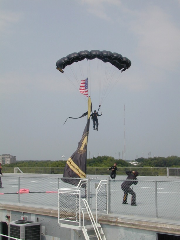 Special Operations Command parachutist coming in on the flight deck of Yorktown.