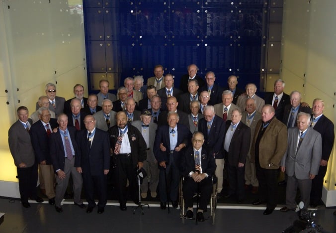 Medal of Honor recipients at the MOH museum opening in May 2007. John Finn is in the front row, first standing on the left hand side of the wheelchair.