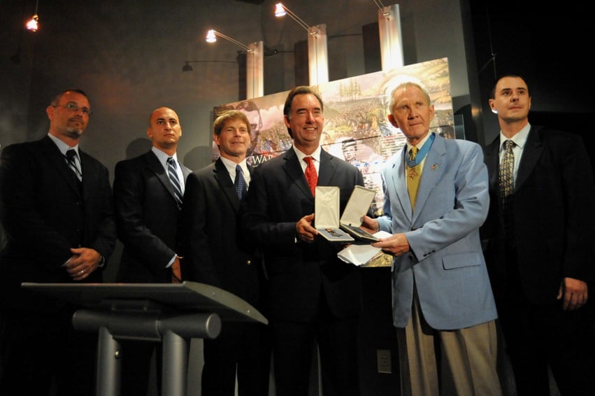 090821_FBI-MOH_008 Maj. Gen. James Livingston accepts returned medals from FBI agents.