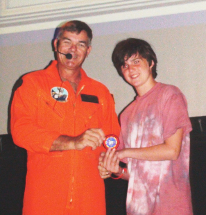 Life Scout Earl Wells, Troop 757 Huntsville, Alabama, is awarded the coveted "Top Gun" patch on USS Yorktown, CV-10.