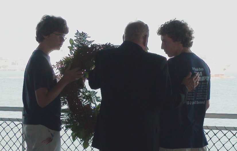 pd09_3 Mount Pleasant Mayor Kruger Smith offers a few words of remembrance to Moultrie students before the tossing of the wreath.