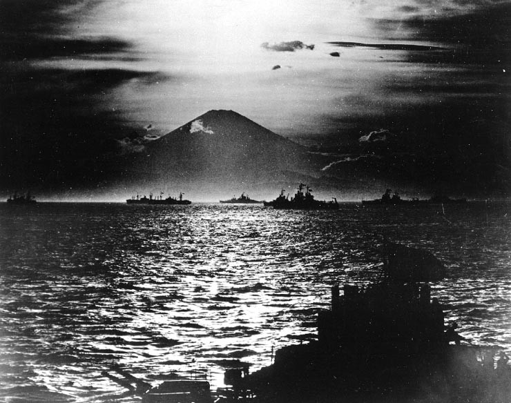 With Allied warships anchored in Sagami Wan, the sun sets behind Mt. Fugiyama and on the Japanese Empire.