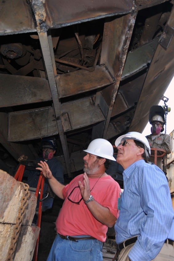 Senator McConnell closely inspects the work on Laffey's hull.