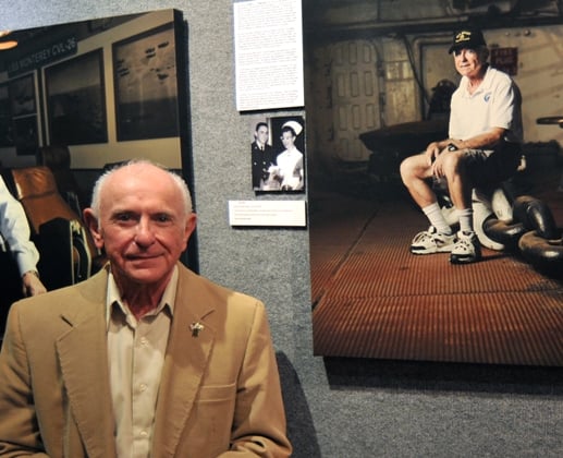 Patriots Point Naval & Maritime Museum photographs Patriots Point volunteer Arnie Stein next to his portrait from "The Veterans of the Fighting Lady" exhibit last November.