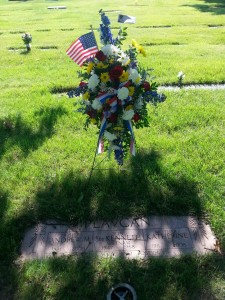 Flowers on the grave of Kenneth Plavcan in Holy Cross Cemetery in Brook Park, Ohio.