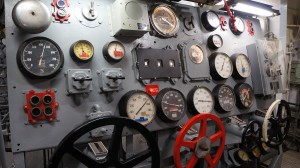 Visitors take the controls in the engine room just as the sailors once did