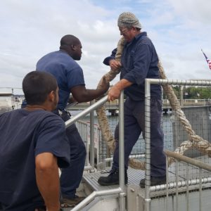 Patriots Point employees add extra line to secure the USS Laffey ahead of Hurricane Matthew.