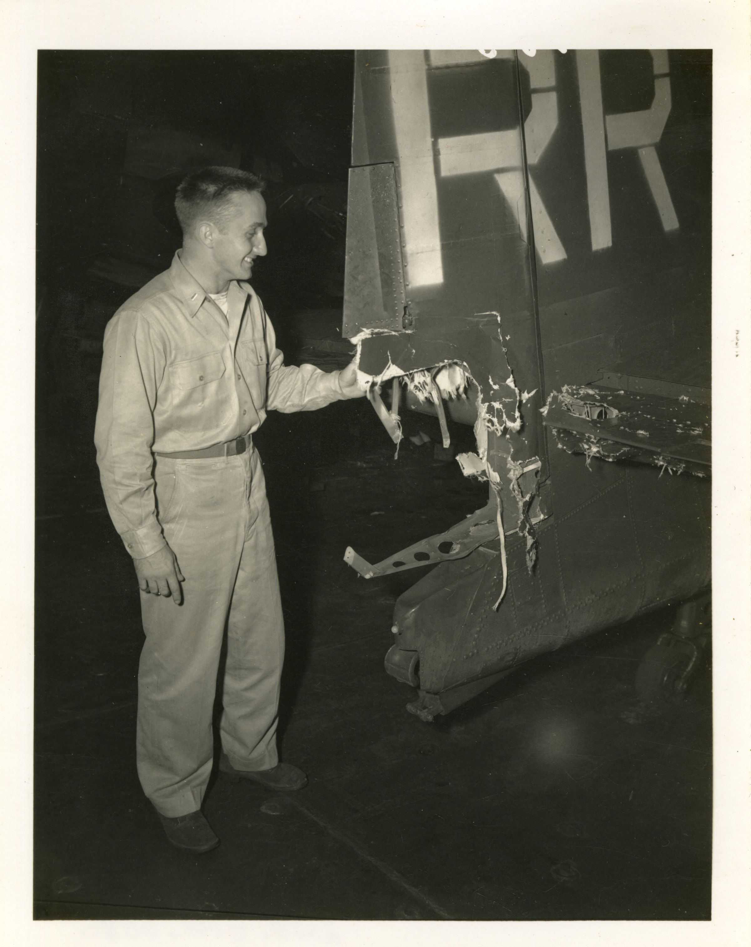 Primary Image of Pilot Looking at Battle Damage