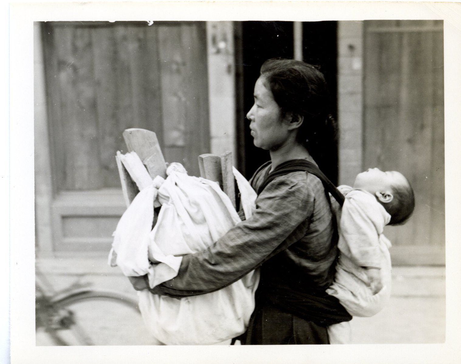 Primary Image of Mother Carrying Wood and Baby