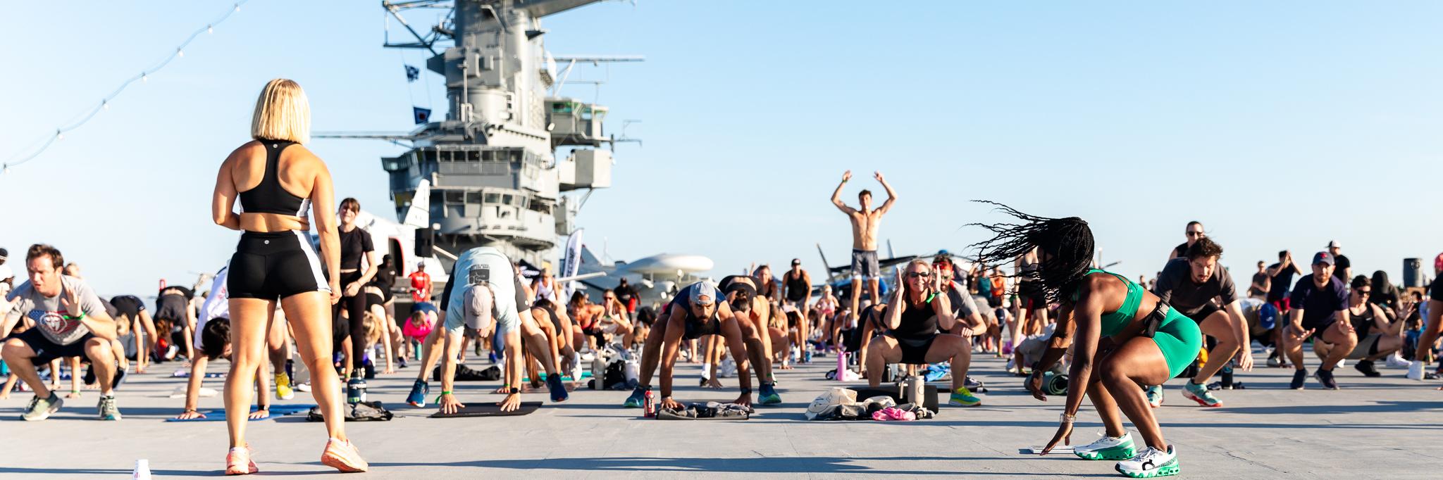 People working out on the flight deck of the USS Yorktown.
