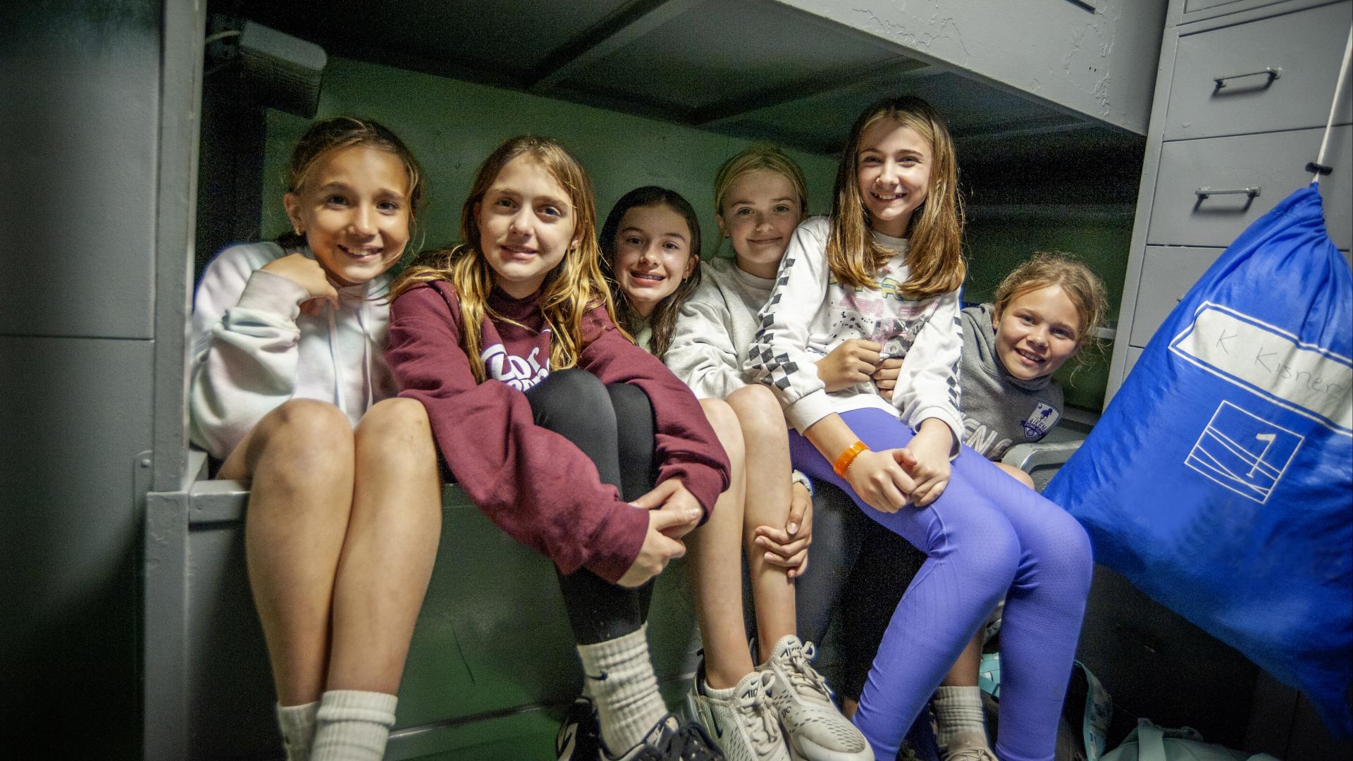 A group of girls pose for a picture during Operation Overnight.