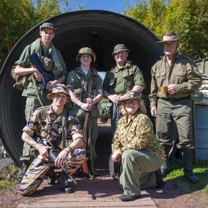 A group of historical reenactors pose in the Vietnam Experience. 
