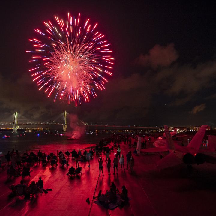 Fireworks blast near the USS Yorktown