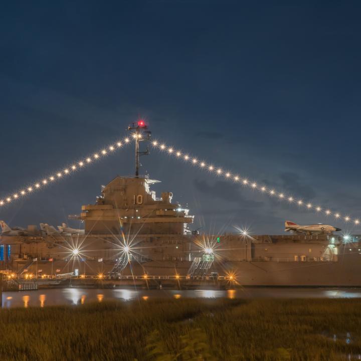 View of the USS Yorktown at night.