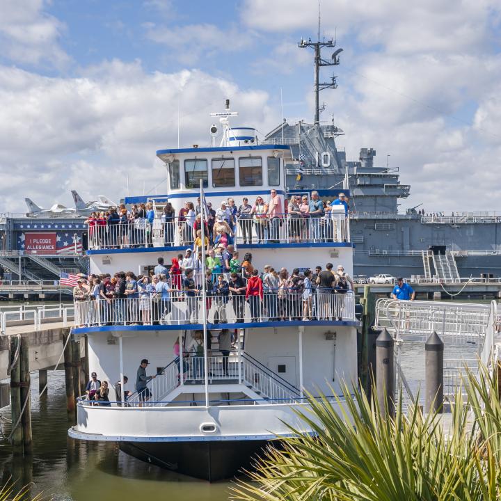 People boarding the boat for a Charleston harbor cruise or Fort Sumter tour.