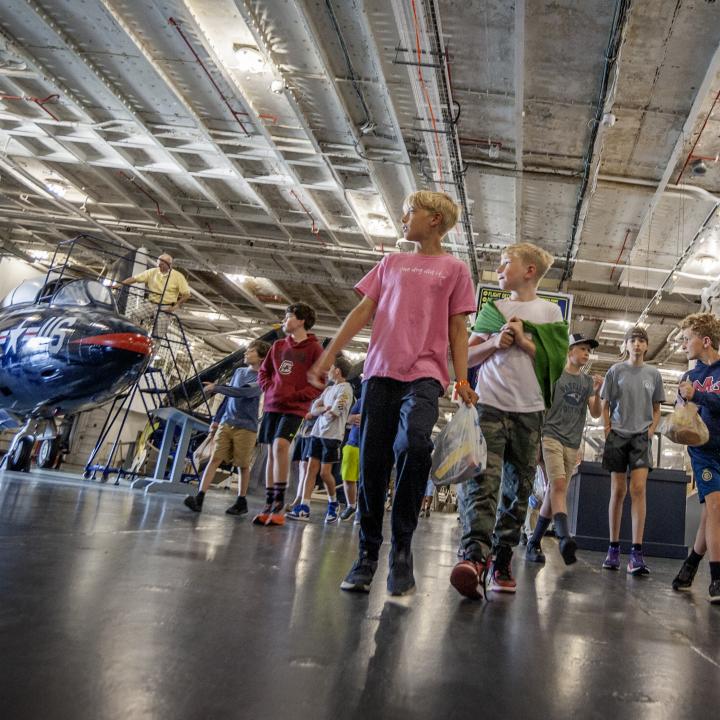 Operation Overnight participants walk the decks of the ship.