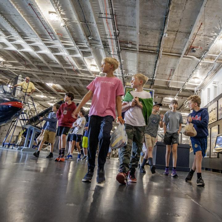 Operation Overnight participants walk the decks of the ship.
