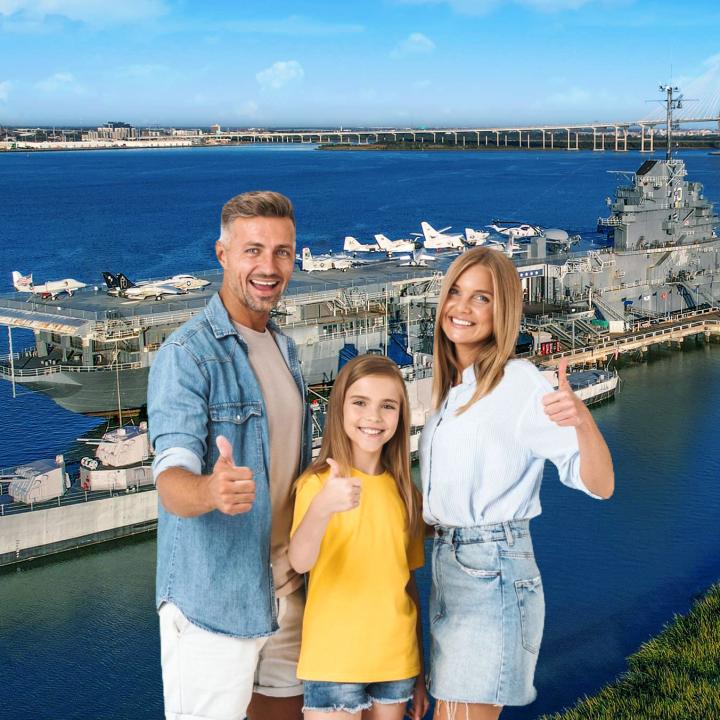 A family stands in front of a Patriots Point backdrop for a group photo. 