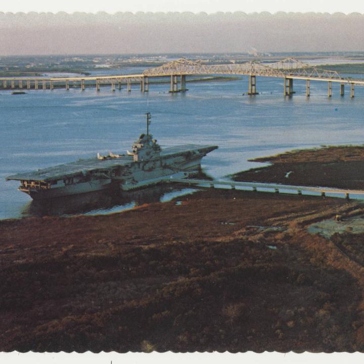 Vintage postcard image of the USS Yorktown in Charleston Harbor.