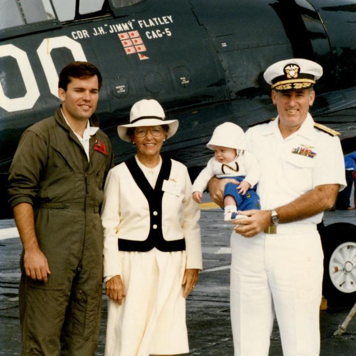 Admiral Flatley and his family posed in front of an aircraft