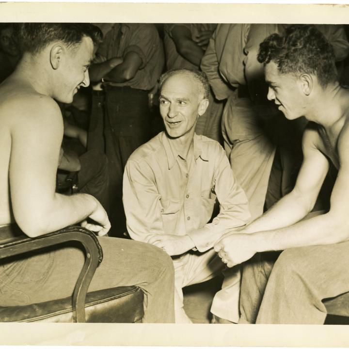 Primary Image of Sailors Talking with Ernie Pyle