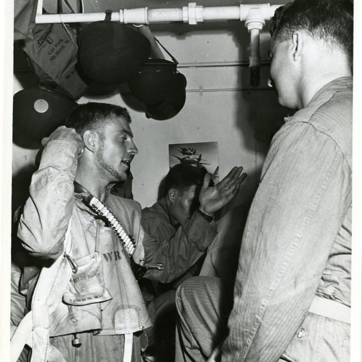 Primary Image of Pilots Discussing Raid