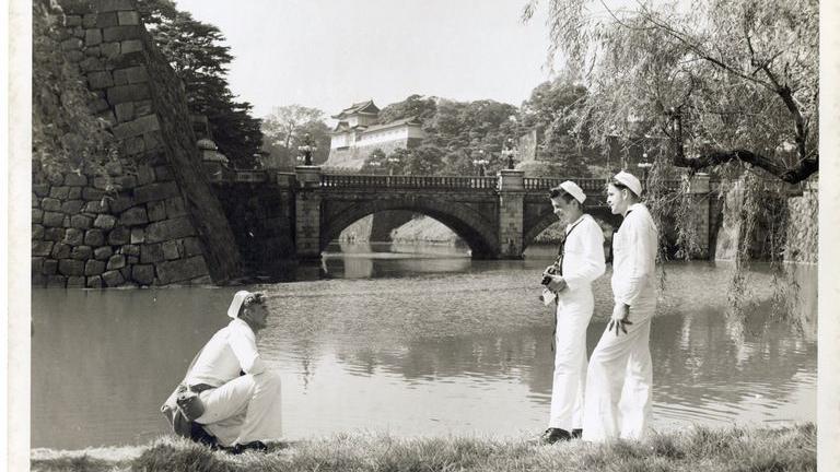 From our collections, sailors stand in the imperial garden in Tokyo. 